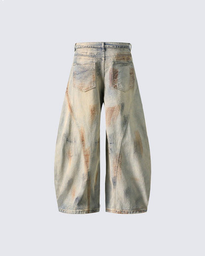 Arc-Cut Distressed Wide-Leg Jeans