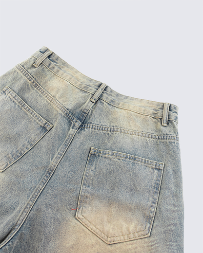 Wide-Leg Denim Jeans with Buttoned Hem